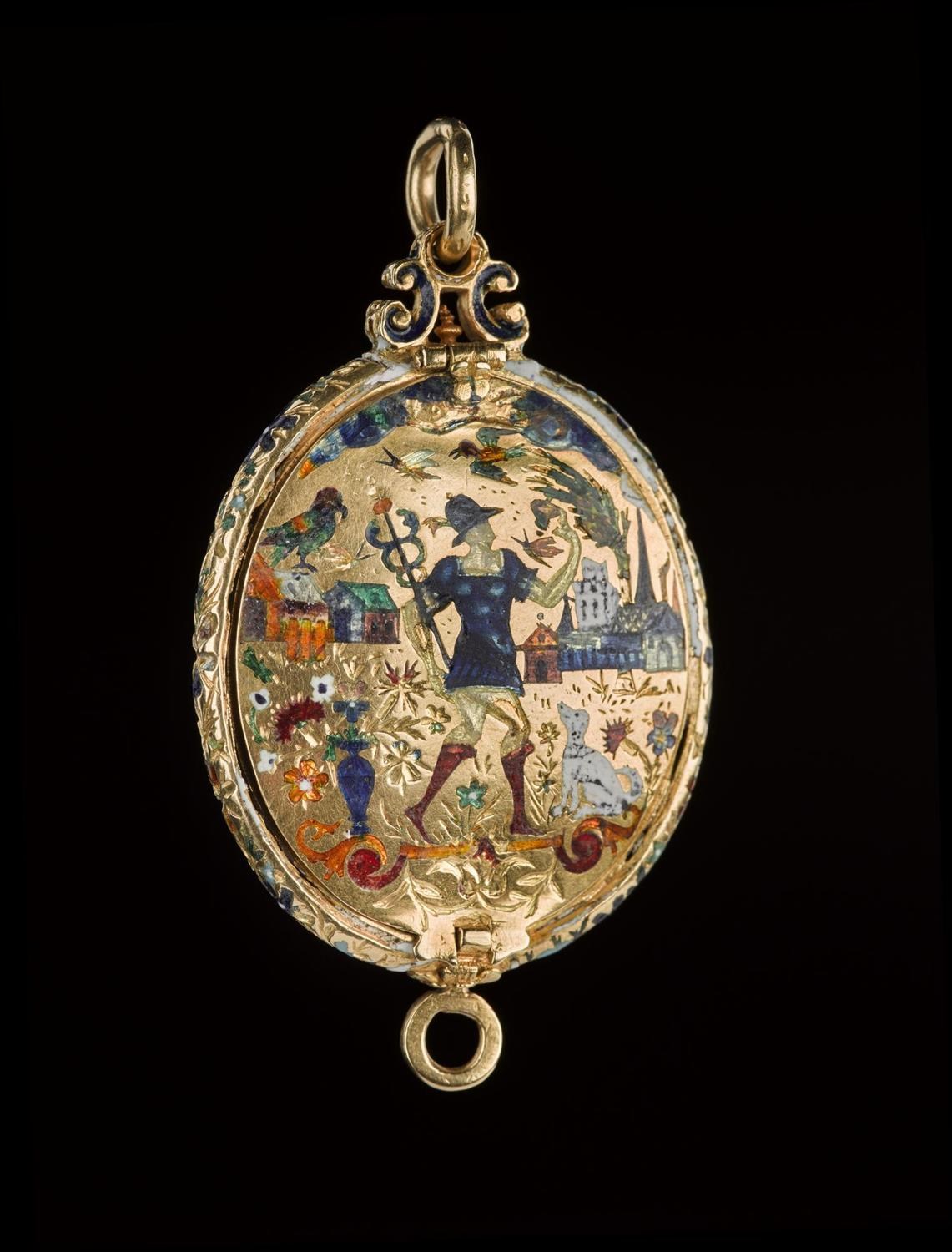 Gold locket with a colourful scene of a person, animals, houses, and plants