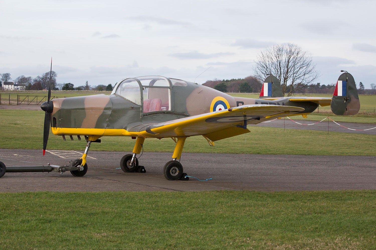 Side view of the General Aircraft Cygnet in an airfield at the National Museum of Flight