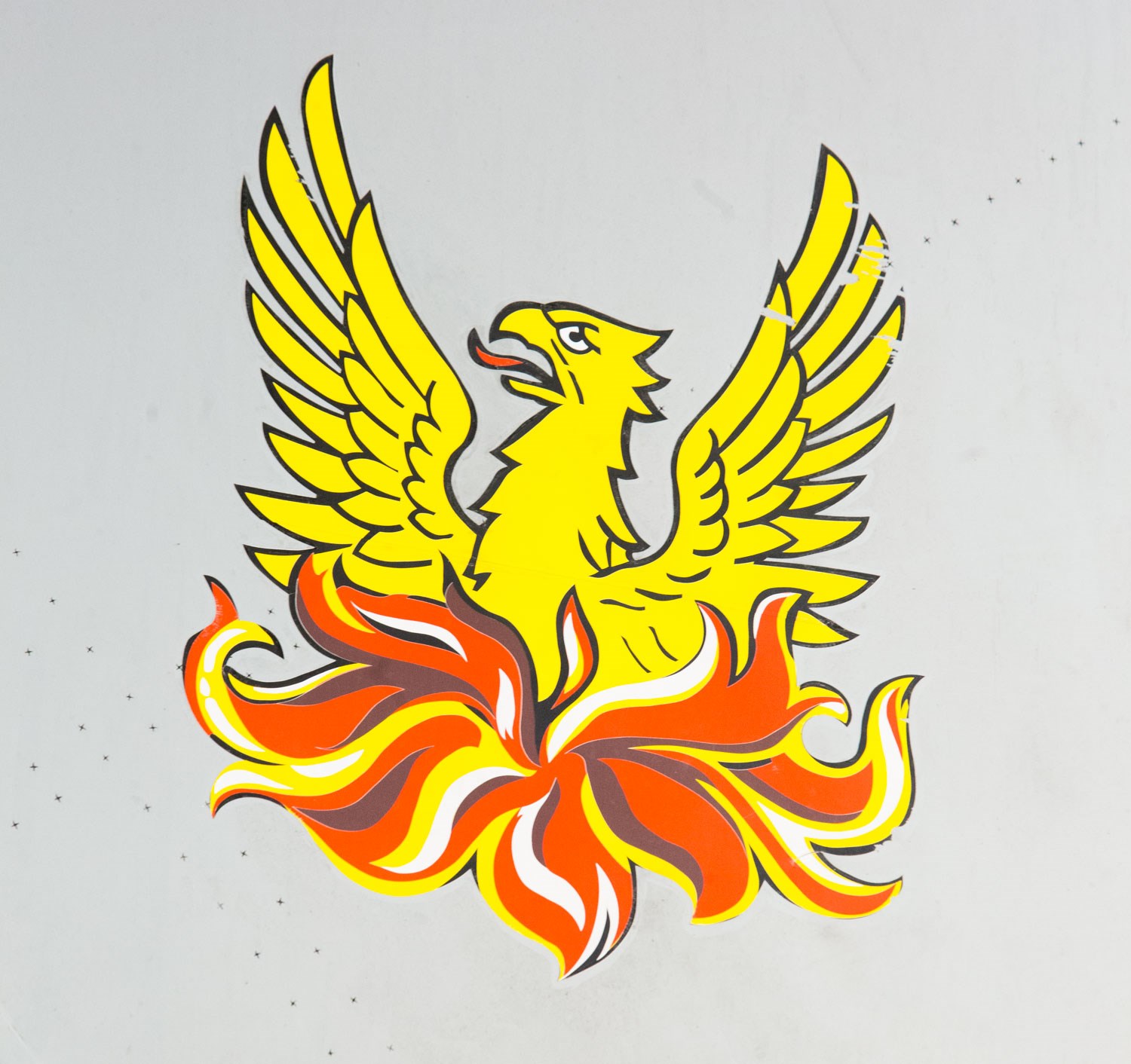 Painted detail of a phoenix rising from the ashes on the side of a Tornado aircraft.