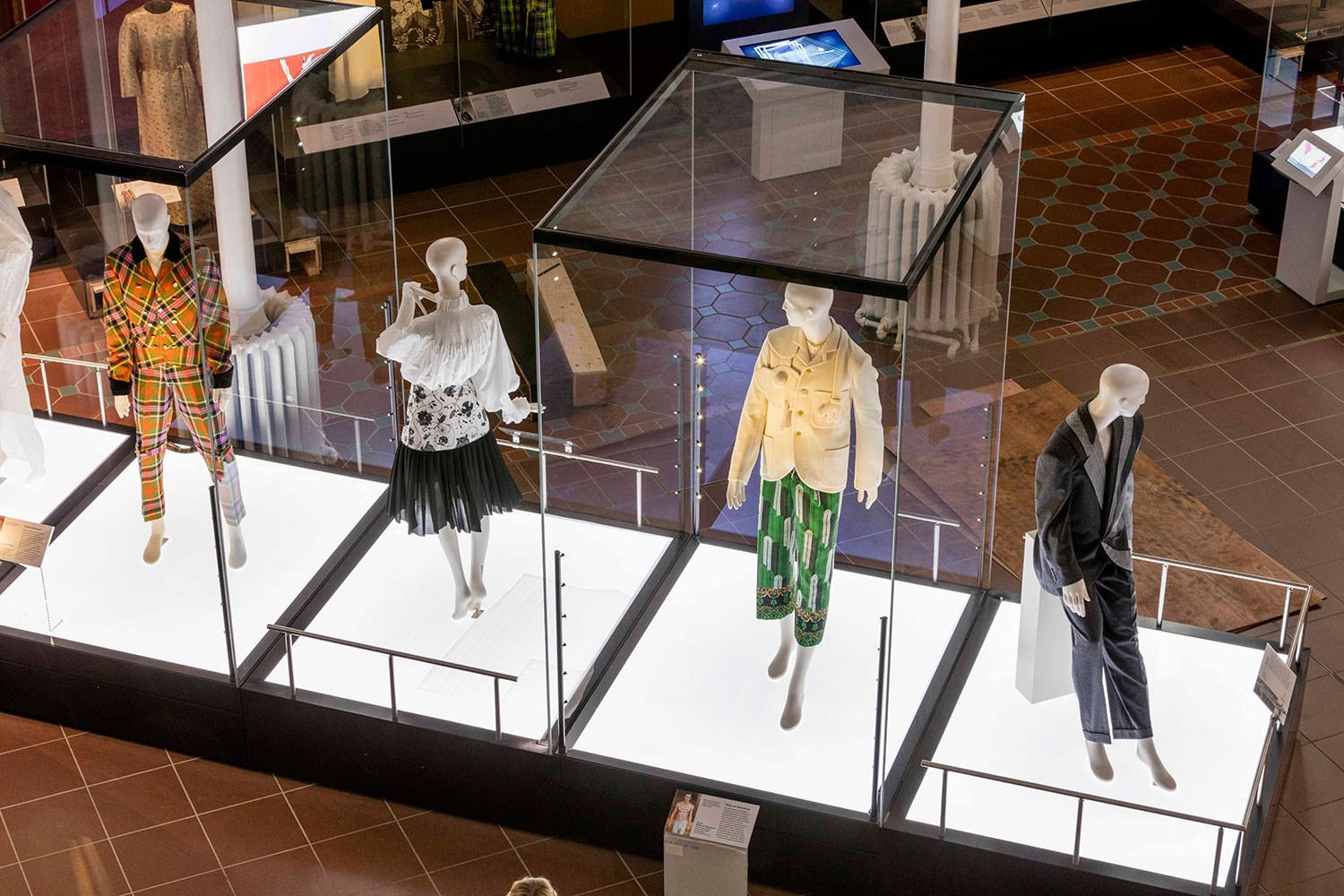 Four mannequins in the Fashion and Style gallery at the National Museum of Scotland. 