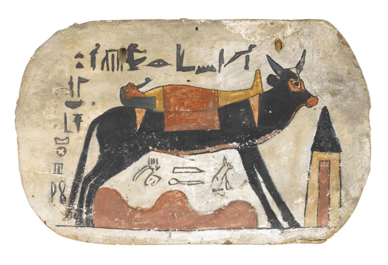 Footboard of wood, from cartonnage coffin or mummy-case, depicting the Apis bull carrying the mummy of the deceased, named as Pamiu, striding over the desert towards a pyramidal tomb: Ancient Egyptian, from Thebes, Upper Egypt, 3rd Intermediate Period, 22nd Dynasty, Osorkon III, 790-762 BC.