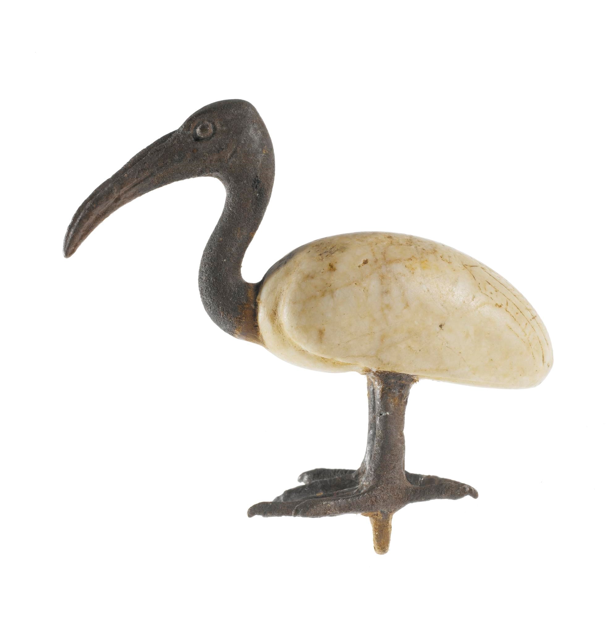Votive statuette in the form of an ibis, the body made of calcite and the head and legs of bronze: Ancient Egyptian, Late Period.