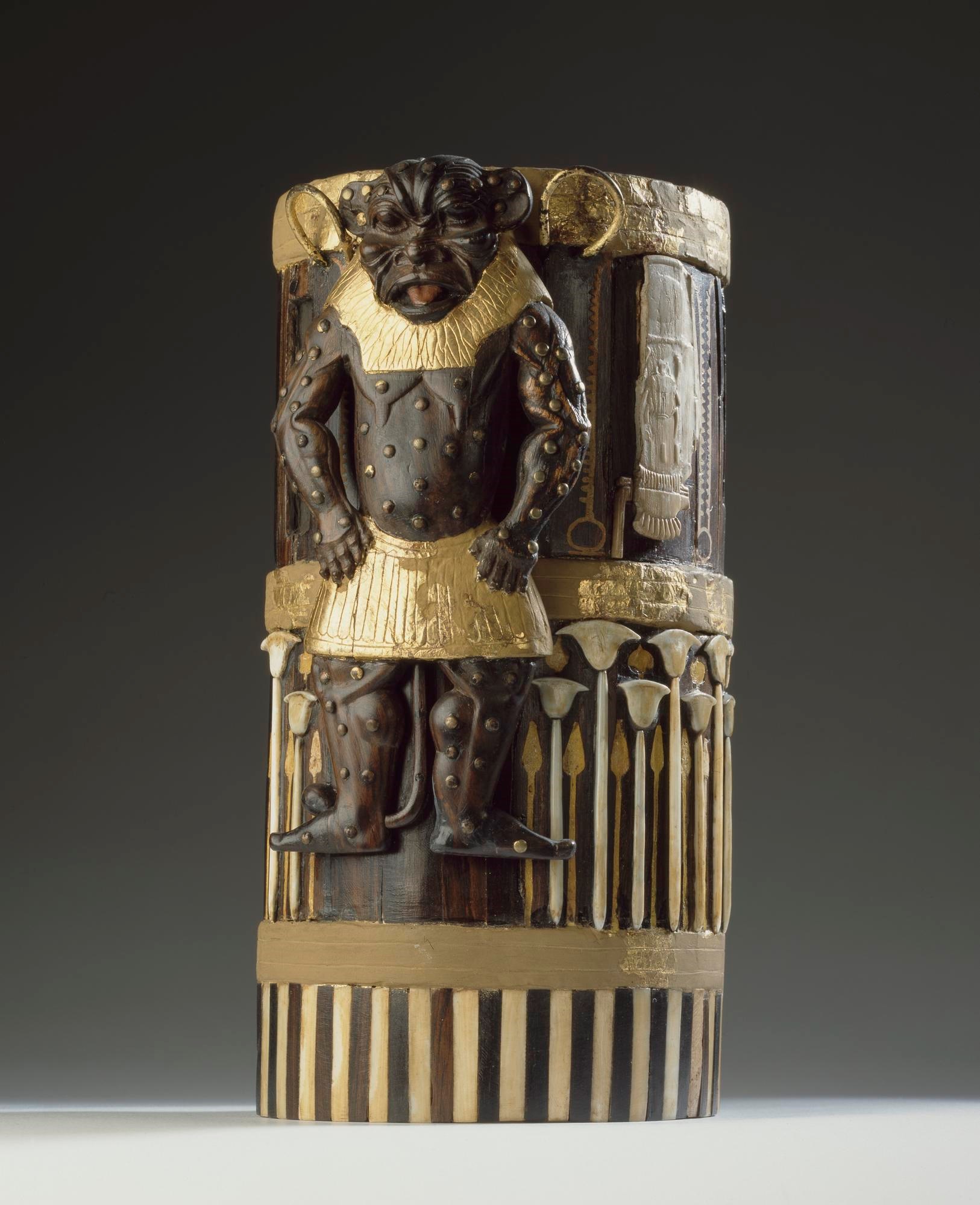 Box of cedar wood with ebony veneers and ivory inlays and gilding depicting the god Bes and bearing the cartouches of Amenhotep II: Ancient Egyptian, New Kingdom, 18th Dynasty, c.1550-1295 BC.