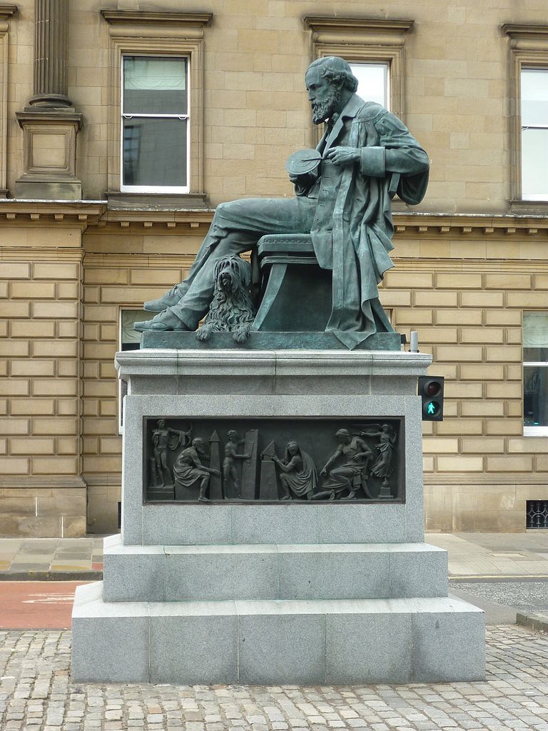 Statue of James Clerk Maxwell shown holding his colour top, erected in 2008 on George Street in Edinburgh.