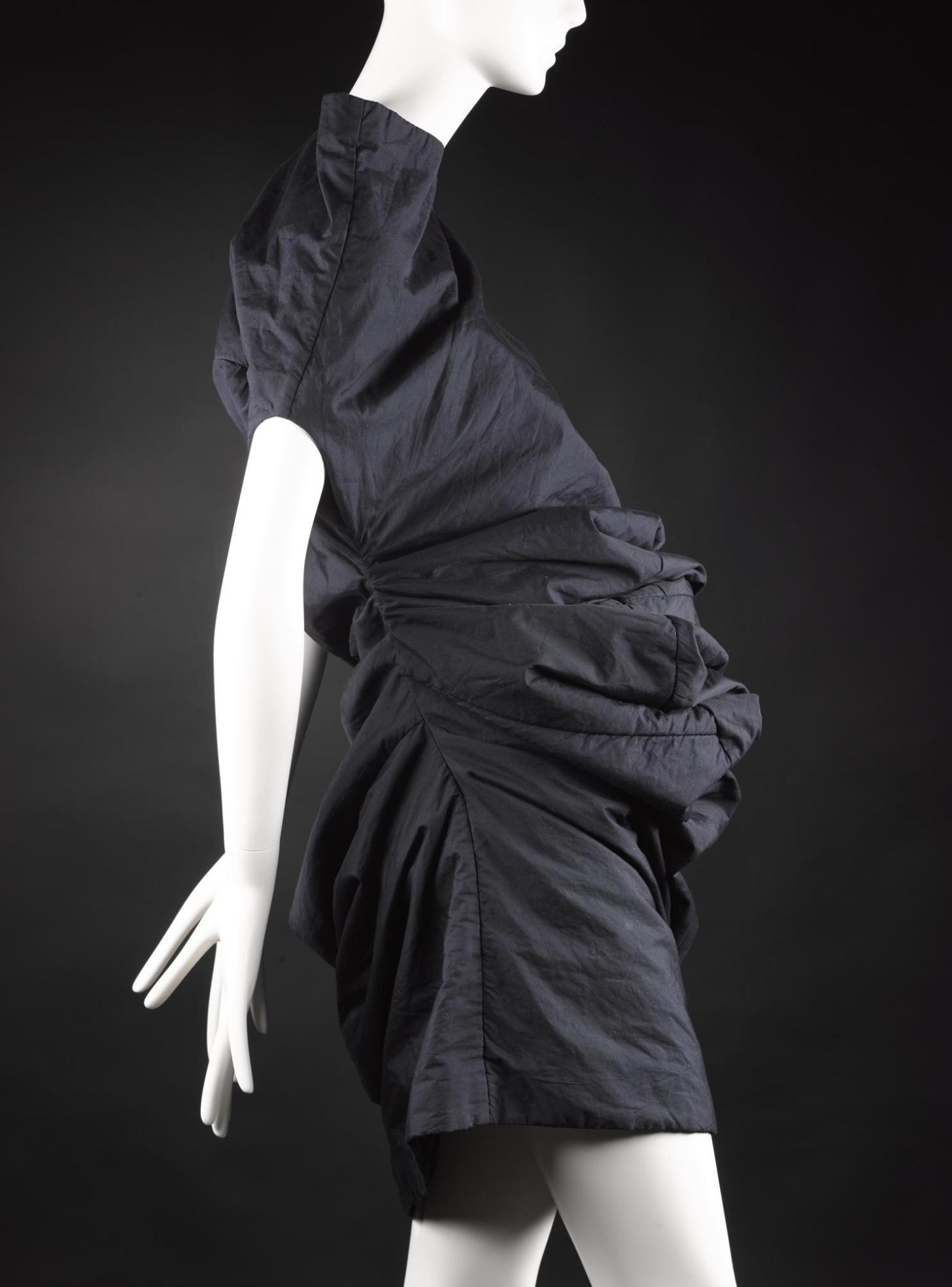 Dress from 'Body Meets Dress' or 'Bump' collection, of blue/black polyester and cotton, padded with tulle, designed by Rei Kawakubo for Comme des Garçons, Spring/Summer 1997.