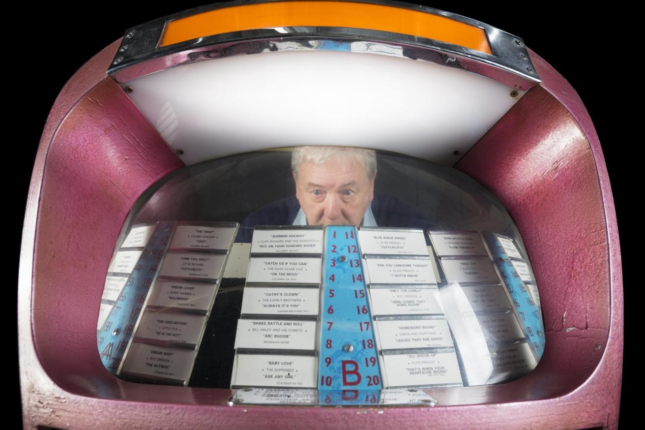 Curator Alan Mills and selected tracks on the jukebox