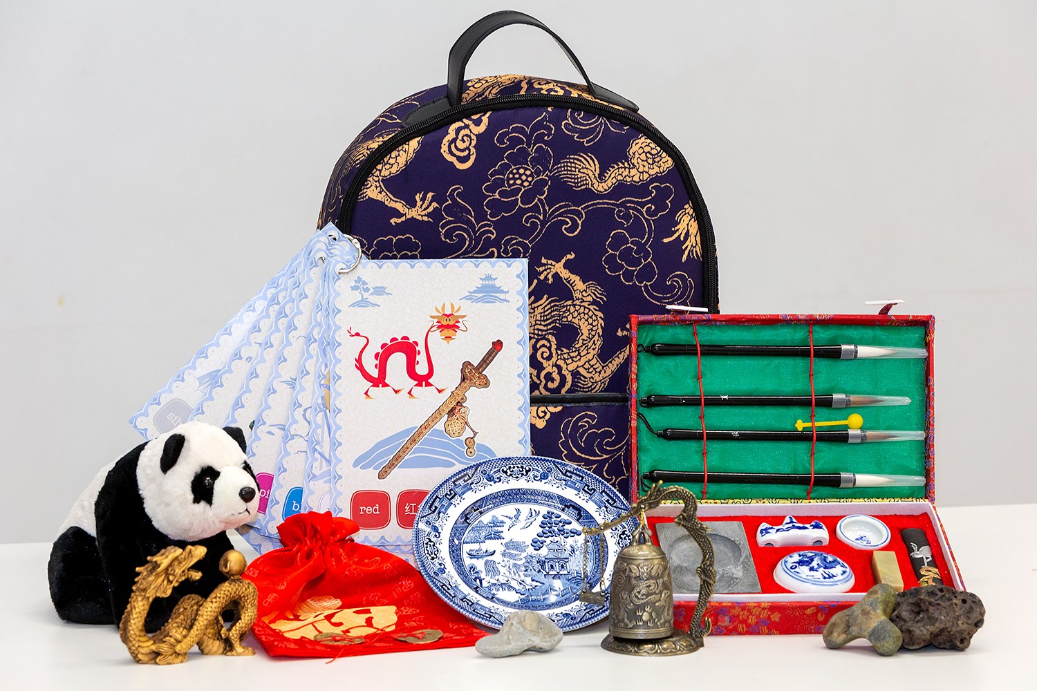Backpack with selection of Chinese objects in front