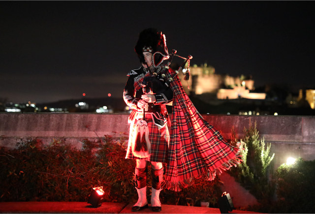 A piper on the National Museum of Scotland's Roof Terrace.