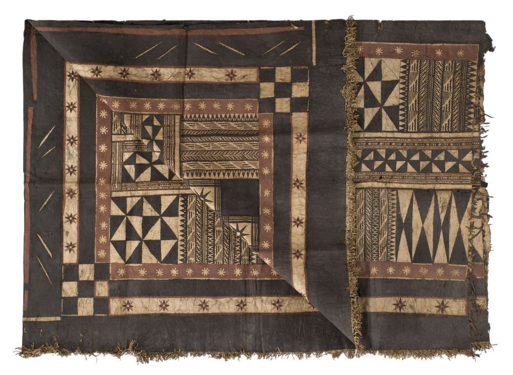 Rectangle of seemingly thin barkcloth with black and beige geometric patterns divided into three subsections.