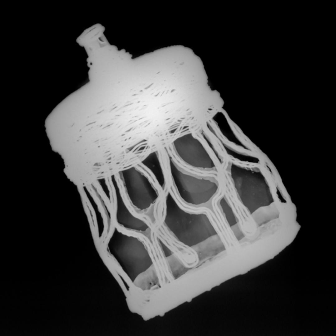 X-ray image of a drum-shaped vessel with mesh-patterned overlay, base and spouted top highlighted in bright grey.