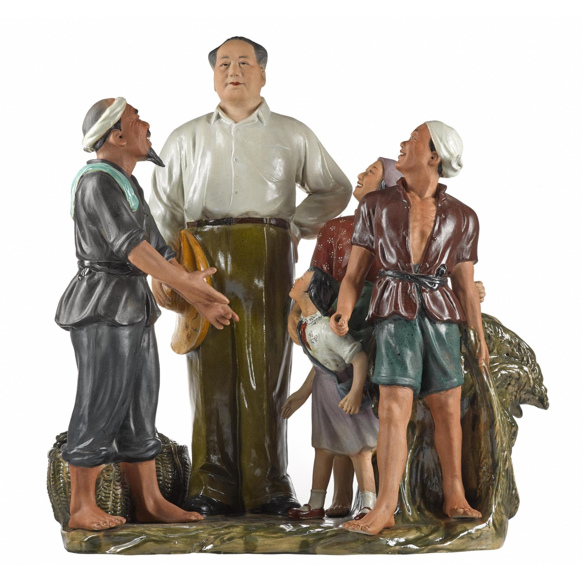 Porcelain figure group of people looking up at Mao Zedong
