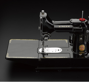 Portable electric sewing machine