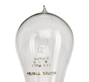 Electric lamp, carbon filament