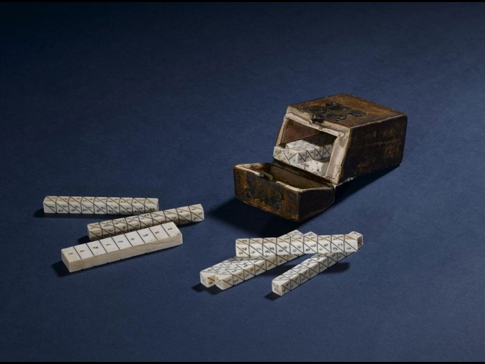 Set of Napier's bones in ivory, in a small leather case, c. 1650. On display in Level 1 of the Scottish galleries in the National Museum of Scotland.