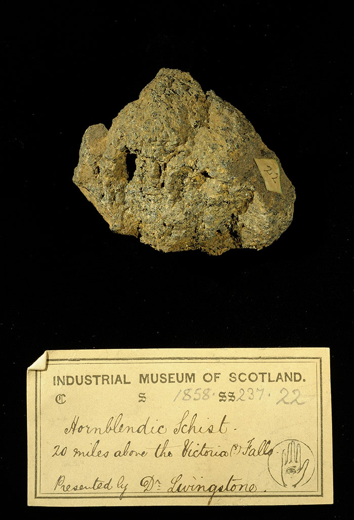 Specimen of hornblendic schist with 19th century museum label: ‘Hornblendic schist. 20 miles above the Victoria Falls. Presented by Dr Livingstone.’