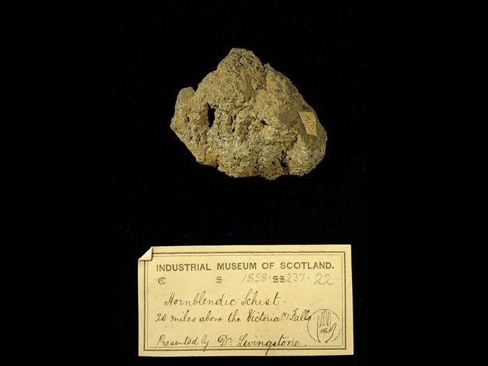 Specimen of hornblendic schist with 19th century museum label: ‘Hornblendic schist. 20 miles above the Victoria Falls. Presented by Dr Livingstone.’