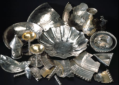 A pile of silver dishes and other objects that are part of the Traprain Law hoard