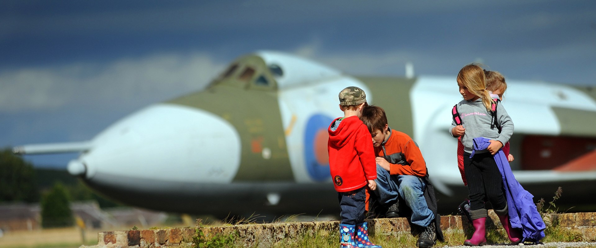 Children outside in front of the Vulcan airplane
