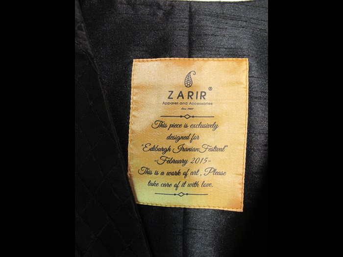 Black coat: label of Zarir brand.
