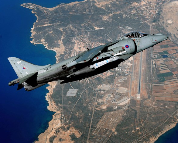 A Joint Force Harrier jet is pictured high over RAF Akrotiri in Cyprus shortly before the iconic aircraft was decommissioned. © Crown Copyright.