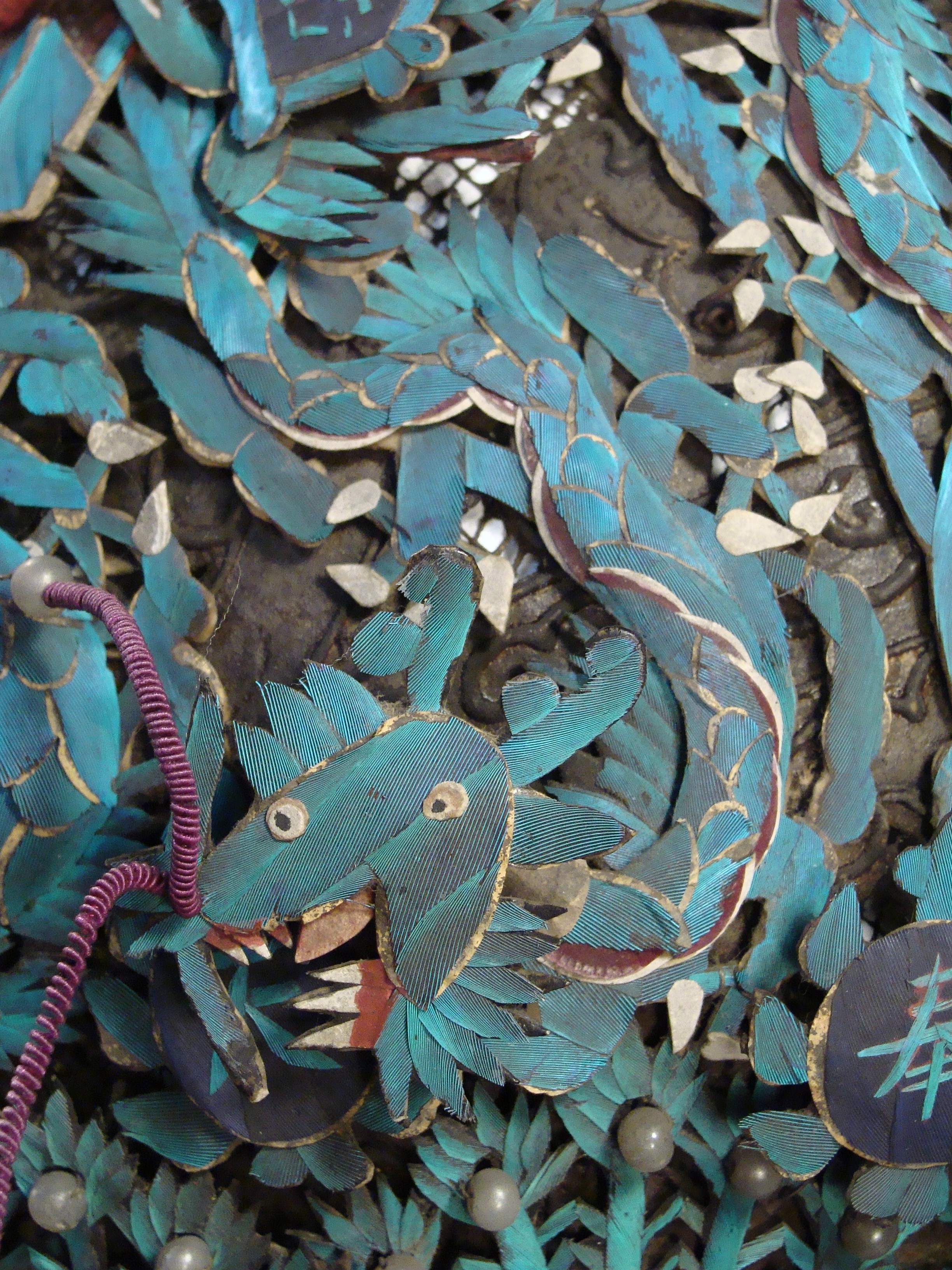 A dragon on the headdress before conservation