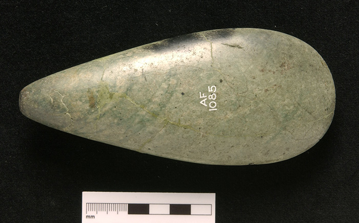 Axehead of jadeitite from Mont Beigua, said to have been found in a cairn at Monzievaird, Perth and Kinross. This had been deliberately burnt. 