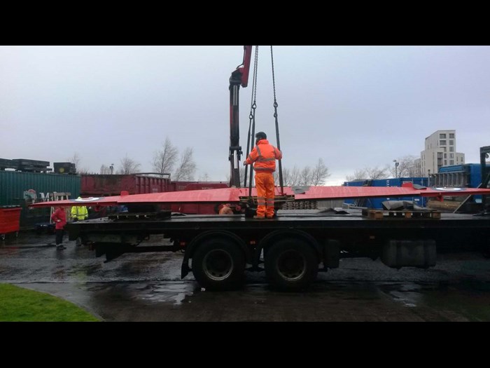 Hoisting the Hawk wings off a heavy loader lorry at National Museums Collection Centre.