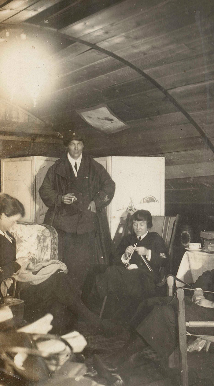 Nurses relaxing in their accommodation at a British hospital at Wimereux, France, 1918. This photograph was taken by Janet Cadell, a Voluntary Aid Detachment nurse serving with the Red Cross.