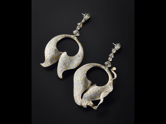 Platinum earrings made by Andrew Metcalfe and designed and decorated by Malcolm Appleby, 1993. You can see these earrings in the Making and Creating gallery in the National Museum of Scotland.