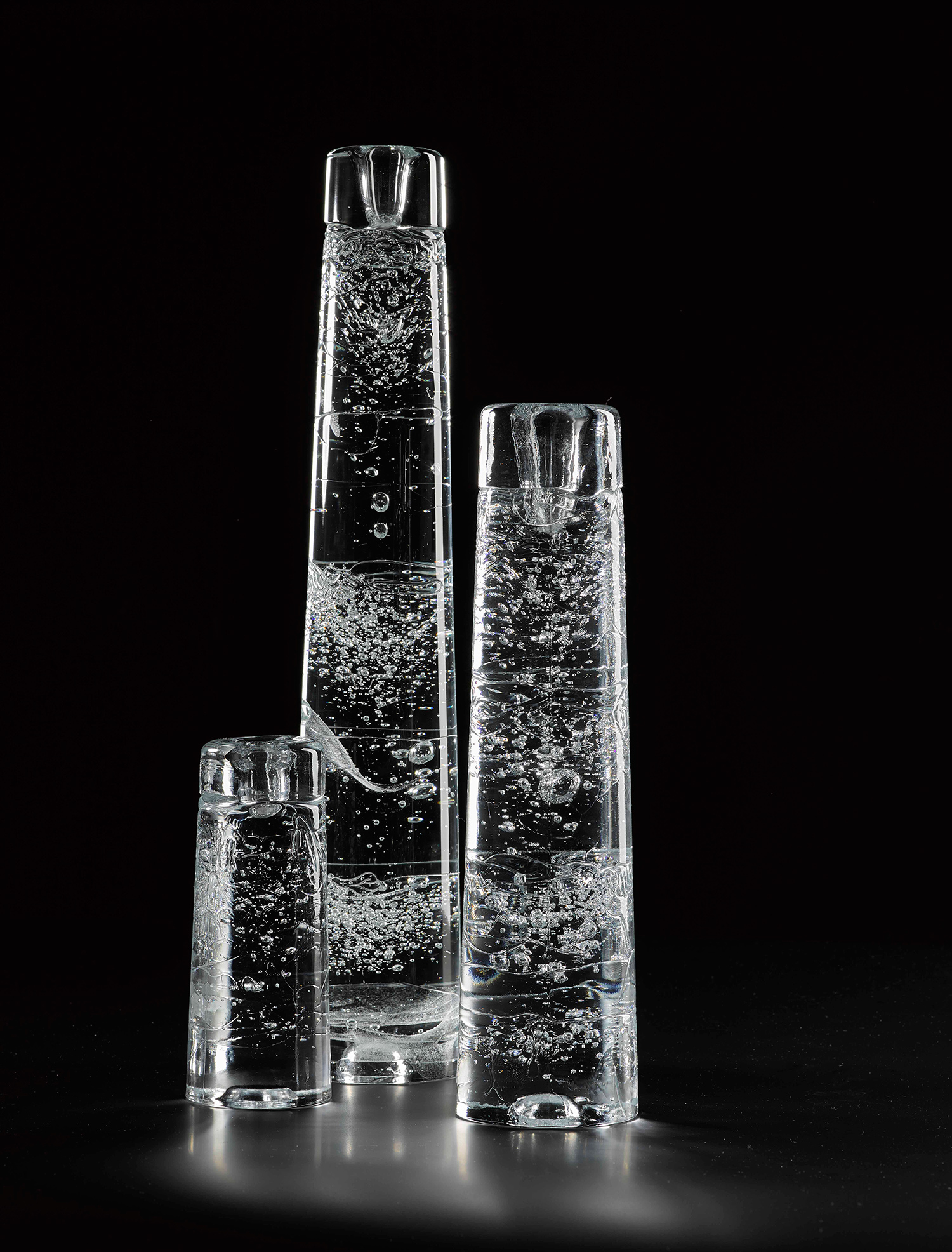 'Arkipelago' candle holder of cast clear glass with visible bubbles and irregular surface, designed by Timo Sarpaneva for Iittala, Finland