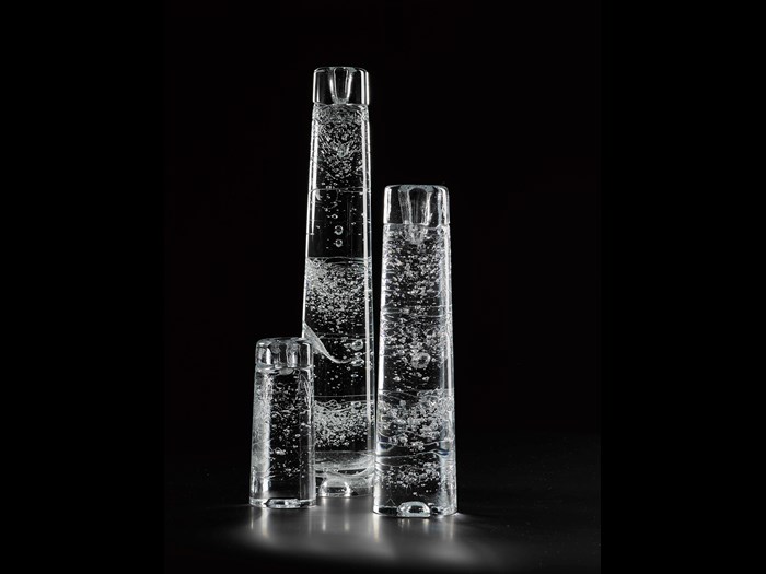 'Arkipelago' candle holder of cast clear glass with visible bubbles and irregular surface, designed by Timo Sarpaneva for Iittala, Finland