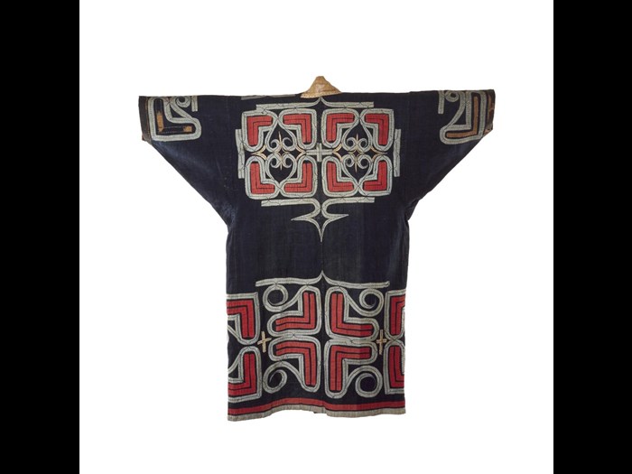 Robe (ruunpe), dark blue cotton cloth with red and white abstract applique decoration, worn during a ceremony: Japan, Hokkaido, Ainu, 19th to early 20th century. On display in the Living Lands gallery, National Museum of Scotland.