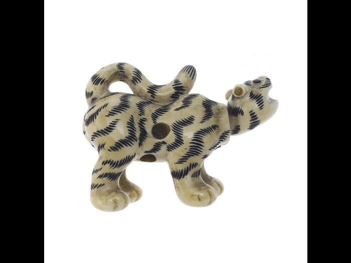 Netsuke of tiger made from carved ivory. On display in the Imagine gallery, National Museum of Scotland. 
