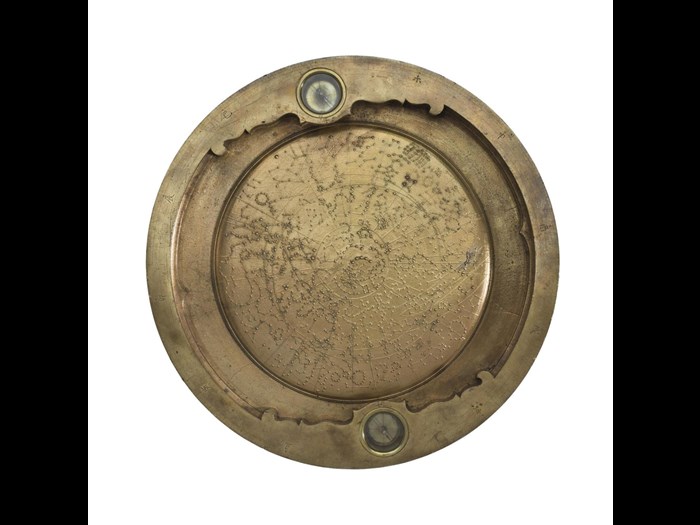 Bronze planisphere with two magnetic needles in a raised border, the centre representing a portion of the sidereal heavens, made in Japan, probably late 17th century.