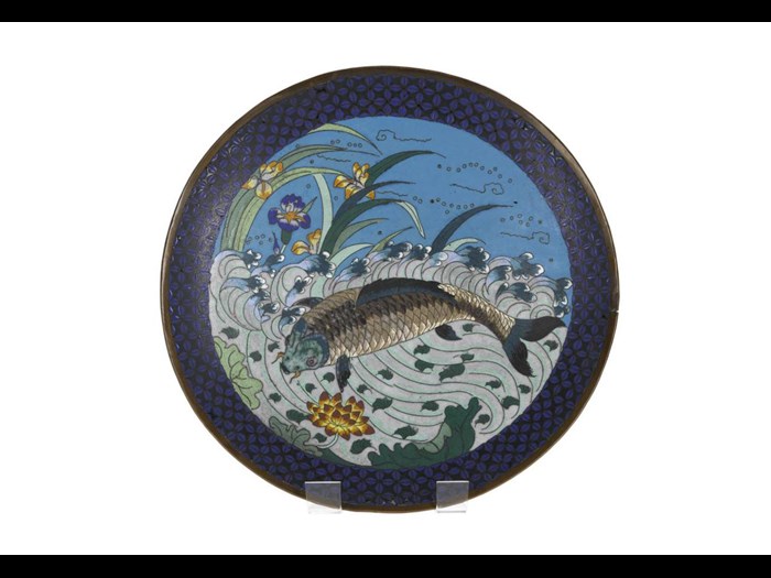 Dish of cloisonne enamel depicting a carp amongst waves with lotus and iris flowers. Japan, 19th century. On display in the Inspired by Nature gallery, National Museum of Scotland.
