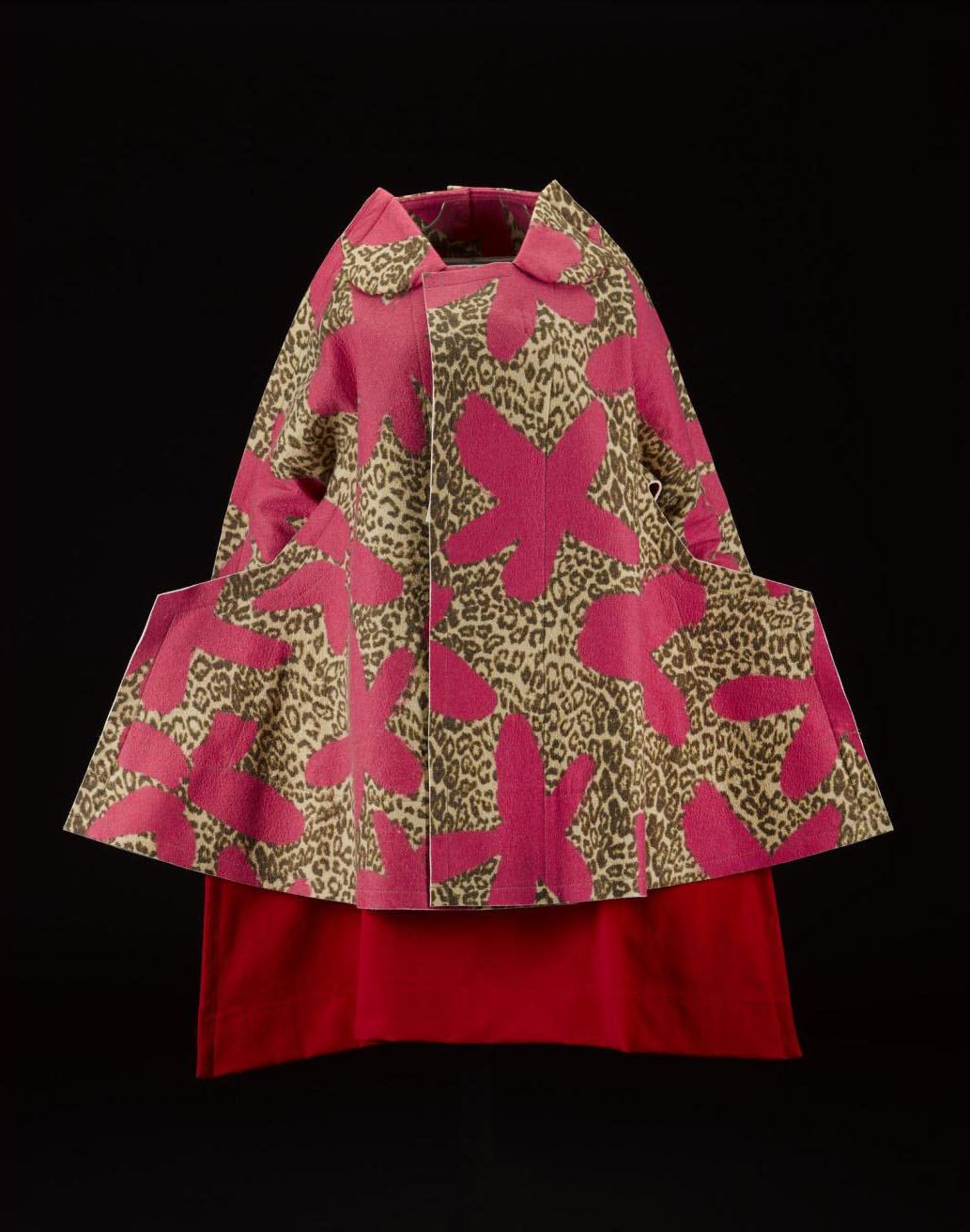 Woman's coat or jacket, felted wool in bright pink floret and leopard print, with angular shaped hips, from the Commes des Garcons, 'Flat' or '2D' collection, Autumn-Winter 2012, designed by Rei Kawakubo. On display in the Fashion and Style gallery.