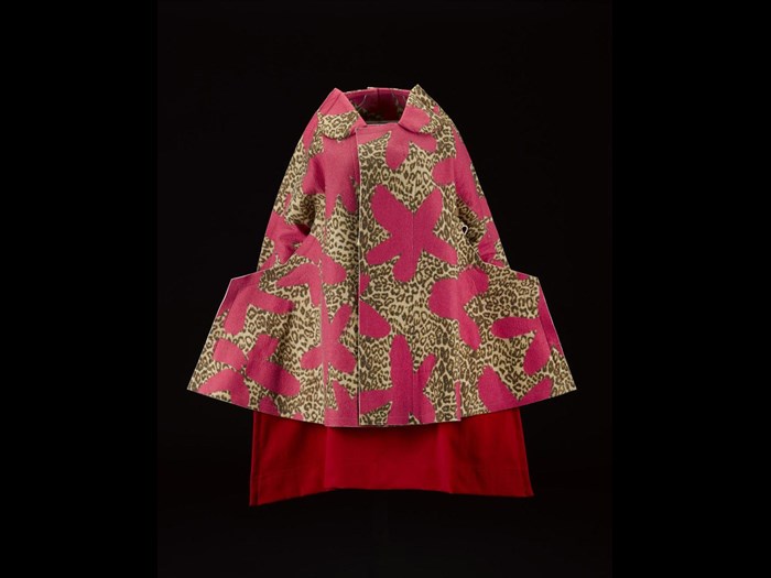Woman's coat or jacket, felted wool in bright pink floret and leopard print, with angular shaped hips, from the Commes des Garcons, 'Flat' or '2D' collection, Autumn-Winter 2012, designed by Rei Kawakubo. On display in the Fashion and Style gallery.