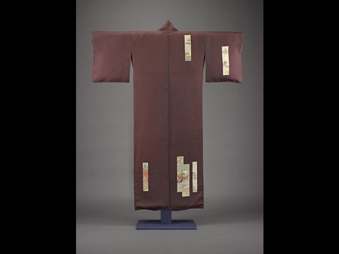 Woman's mauve silk kimono with figured satin crepe stencil painted with scattered poem cards in different colours, with a white silk lining: Japan, c1930-40.