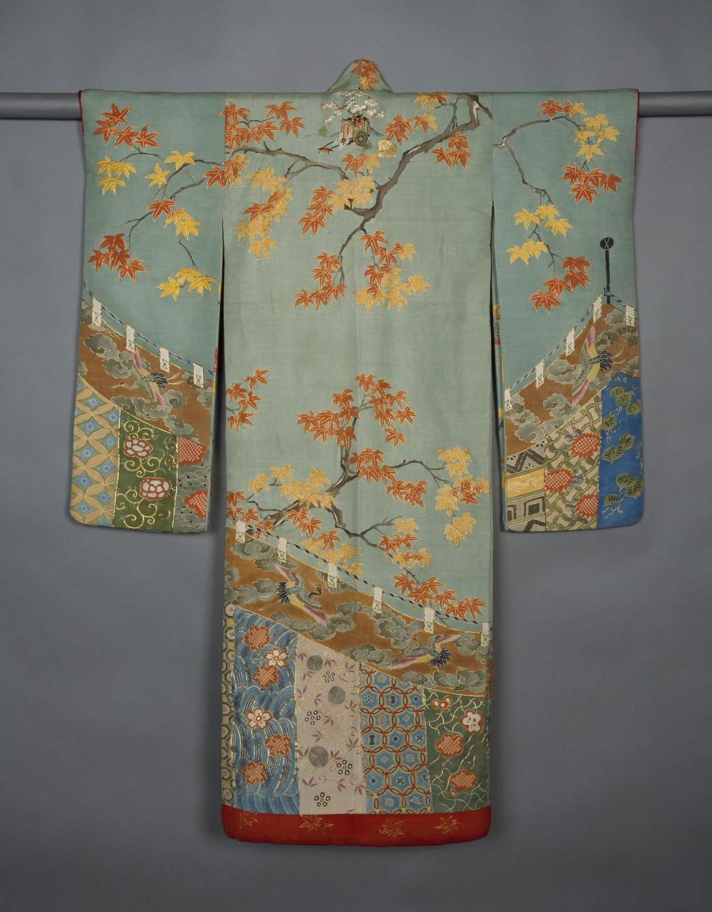 Young woman's robe (furisode), of rep silk with design of maple branches above a festival curtain, outlined with couched gold thread, with padded hem and red silk lining, possibly for wedding ceremony: Japan, 1868-1900.