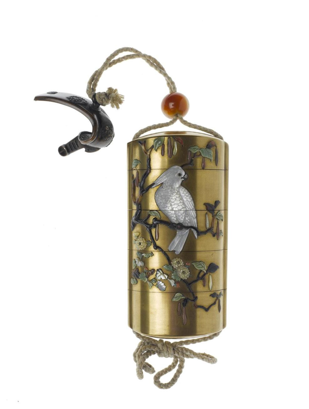 Inro with four compartments, of lacquered wood decorated Shibayama style in mother-of-pearl, steatite, jadeite and tortoiseshell with a cockatiel on a branch, suspended from a stirrup-shaped netsuke of bronze, and held by an ojime of agate: Japan, 19th century.