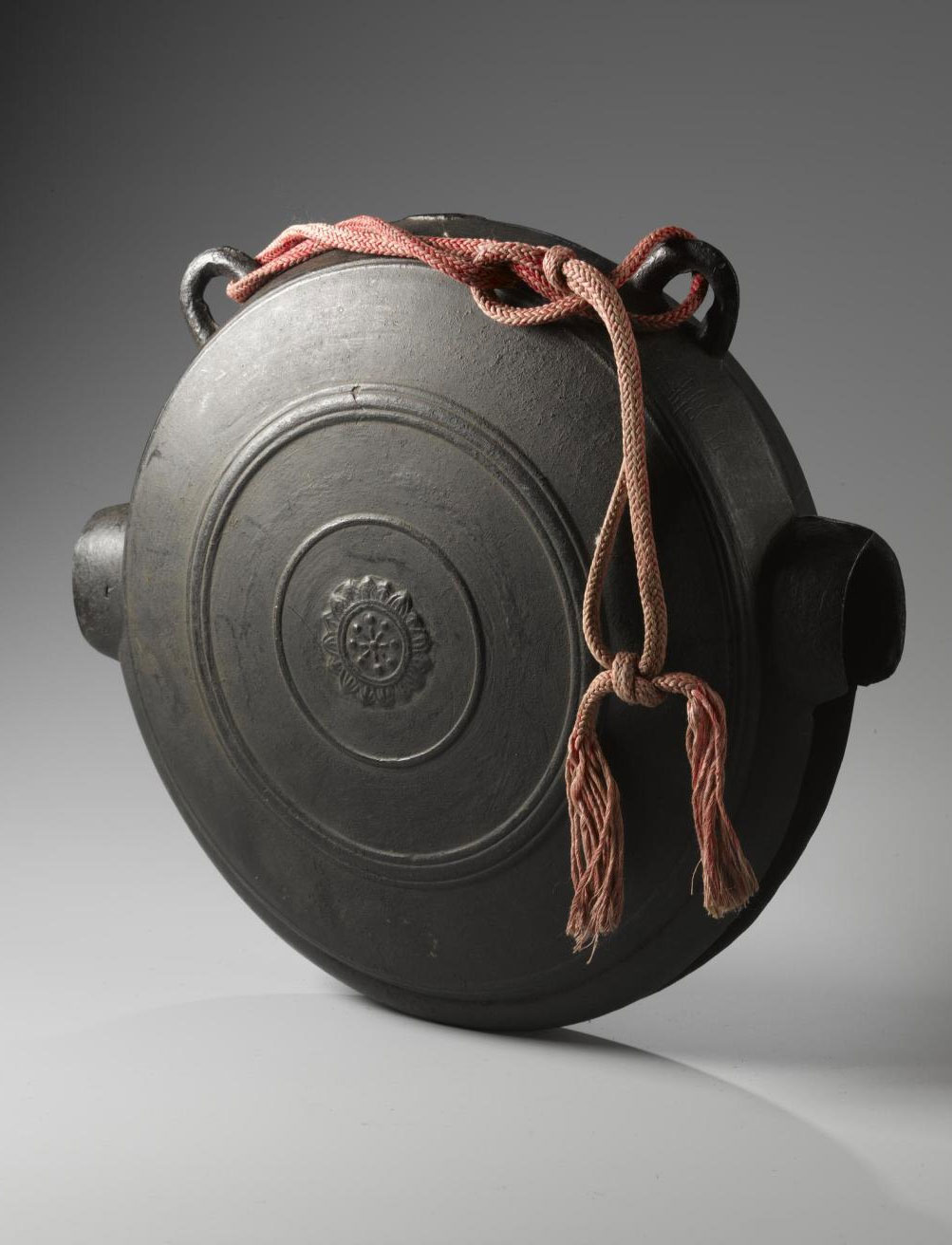 Buddhist crocodile-mouth gong (waniguchi) of bronze with loops for suspension: Japan.