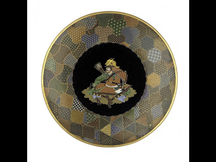 Dish of copper and cloisonne enamel with a seated figure of a warrior in centre: Japan, Yokohama, by Goto Seizaburo, c1880.