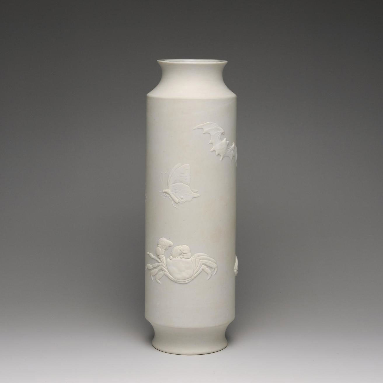 Bisque-fired cylindrical porcelain vase with decoration of insects and sea creatures in low relief: Japan, Hirado Mikawachi, by Yamoto, 1840-80.