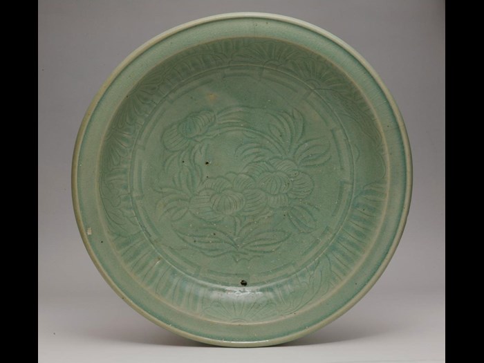 Large celadon stoneware dish: Japan, Arita, 1660-1710.