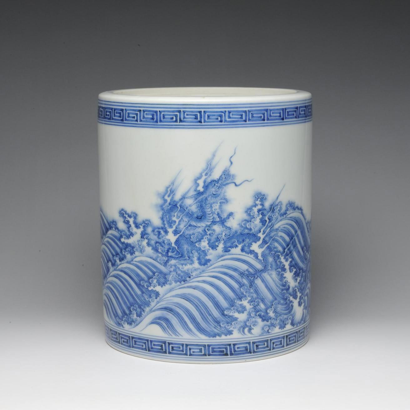 Straight-sided porcelain water jar (mizusashi) with design of blue dragons in surging waves: Japan, Hirado Mikawachi, c1700.