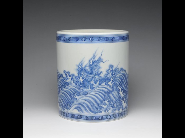 Straight-sided porcelain water jar (mizusashi) with design of blue dragons in surging waves: Japan, Hirado Mikawachi, c1700.