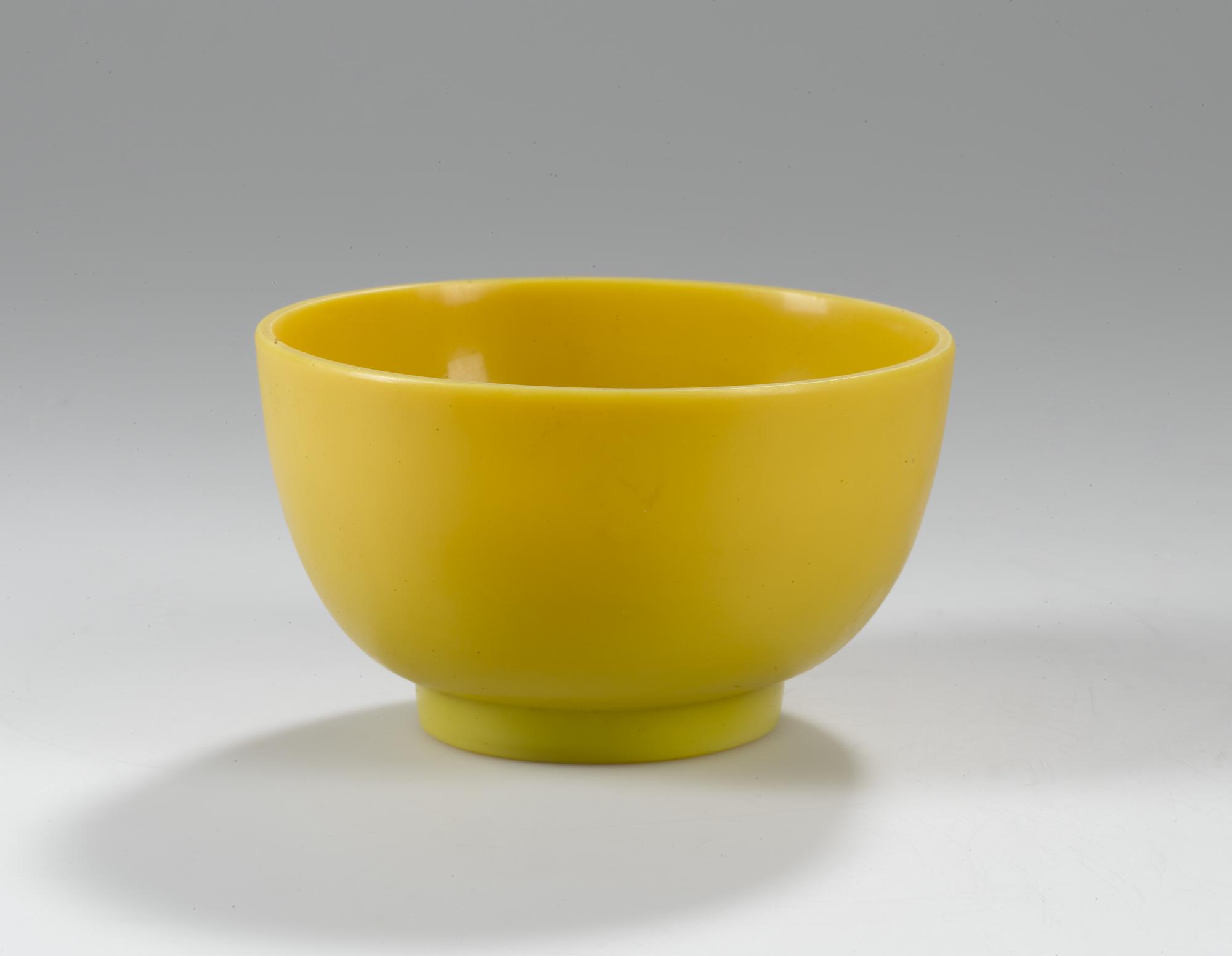 Bowl of imperial yellow glass, one of a pair: China, Qing Dynasty, Qianlong reign, 1736-1795 AD.