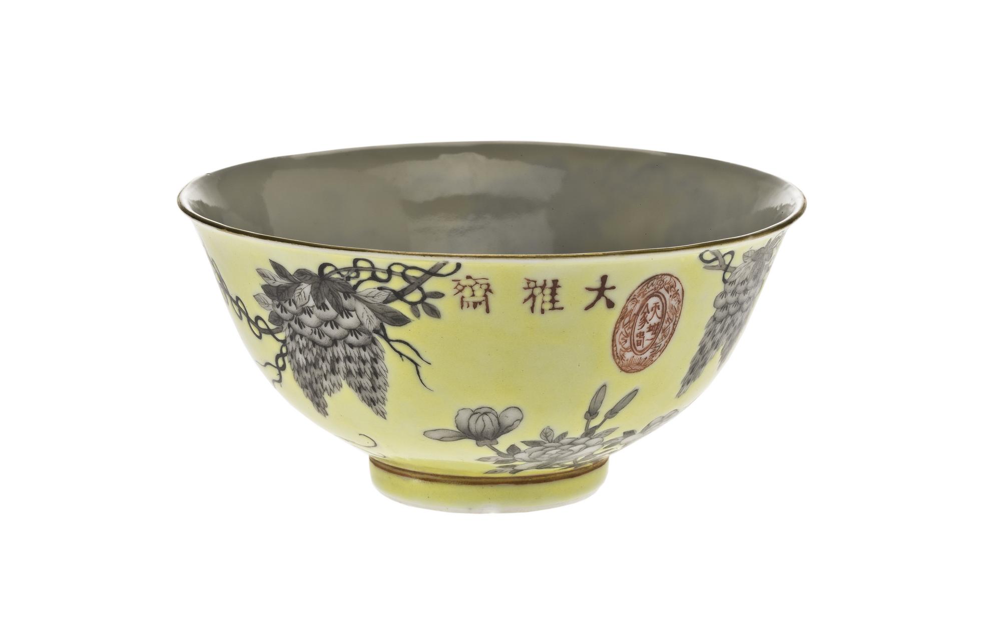 Porcelain bowl decorated in overglaze enamels with a yellow ground and grisaille design of wisteria, peony and a bird, with inscription and marks, part of a porcelain group made in celebration of the 60th birthday of the Empress Dowager Cixi: China, Jiangxi Province, Jingdezhen kilns, Qing Dynasty, Guangxu reign, 1894 AD.