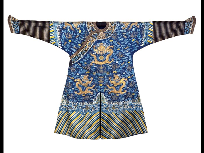 Dragon robe or longpao of deep blue silk embroidered with nine dragons and cosmological designs, showing Manchu influence: China, given to Dugald Christie, medical missionary stationed at Mukden (Shenyang), late 19th century.
