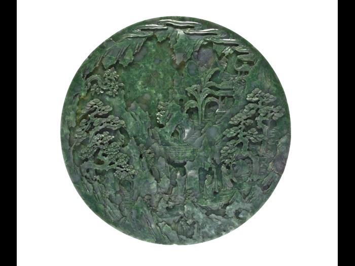Circular table screen (yuan pingfeng) of dark green jade, carved on one side with two Daoist immortals and an attendant carrying offerings, and on the other a landscape: China, Qing Dynasty, 18th century AD.